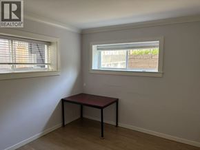 Burnaby apartment for rent - A room with a table and a window.