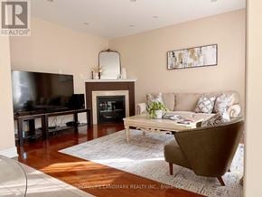 Oakville (Wm Westmount) apartment for rent - A living room with a fireplace and a couch.