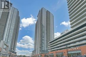 Toronto (Mimico) condo for rent - A cityscape with tall buildings and a clear sky.