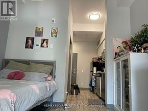 Hamilton (Ainslie Wood) condo for rent - A bedroom with a bed, a closet, and pictures on the wall.