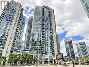 Toronto (Waterfront Communities) condo for rent - A cityscape with tall buildings and a clear sky.