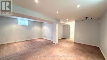 London East (East Q) apartment for rent - A spacious room with a carpeted floor and white walls.