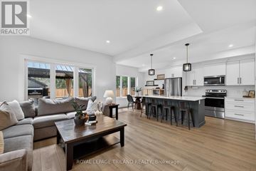 Malahide (Springfield) townhouse for rent - A modern living room with a grey sofa and a wooden coffee table.