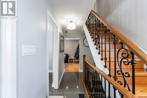 Toronto (West Humber-Clairville) apartment for rent - A hallway with a staircase and a Christmas tree in the background.