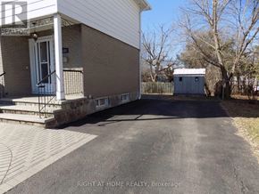 Ottawa apartment for rent - A small house with a garage is for sale.