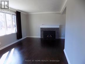Ottawa apartment for rent - A room with a fireplace and a window.
