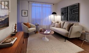 Toronto (Willowdale East) condo for rent - A living room with a couch, chair, and a coffee table.