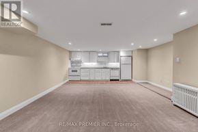 Toronto (Forest Hill South) multi-family for rent - A spacious room with a washer and dryer unit.
