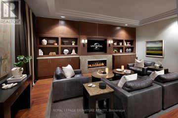 Toronto (Willowdale East) condo for rent - A living room with a grey couch and a coffee table.