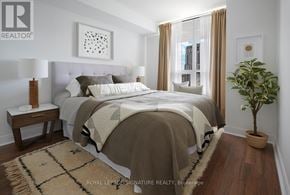 Toronto (Willowdale East) condo for rent - A bedroom with a large bed and a potted plant.