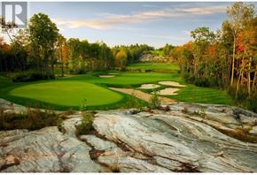 Gravenhurst (Muskoka (S)) condo for rent - A golf course with a large rock formation in the foreground.