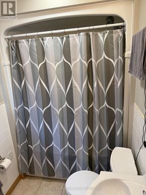 Tillsonburg duplex for rent - A shower curtain with a grey and white diamond pattern.