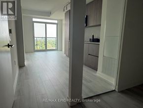 Toronto (Mount Pleasant West) condo for rent - A spacious room with a sliding glass door leading to a balcony.