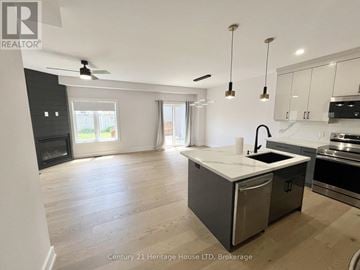 St. Catharines (Secord Woods) apartment for rent - A spacious kitchen with a modern design featuring a stainless steel dishwasher and a white countertop.