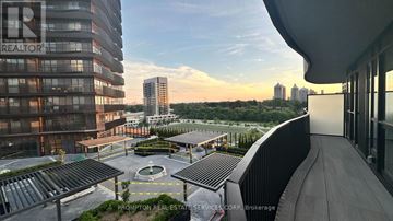 Toronto (Bayview Village) condo for rent - A view of a cityscape from a high-rise building with a sign that reads "REALTOR".
