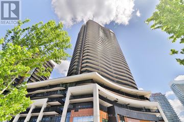 Toronto (Bayview Village) condo for rent - A tall building with a sign that says "Promotion Real Estate Services Corp." on it.