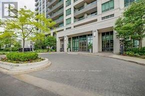 Mississauga (Creditview) condo for rent - A modern building with a circular garden in front.