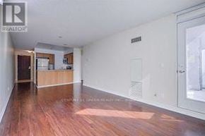 Mississauga (Creditview) condo for rent - A room with wood flooring and a Realty logo.
