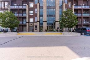 Burlington (Uptown) condo for rent - A building with a large glass window in the center and a car parked in front.