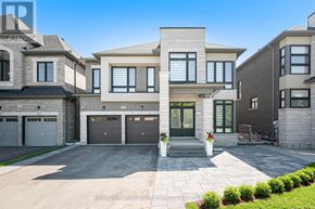 Aurora apartment for rent - A modern two-story house with a garage and a driveway.