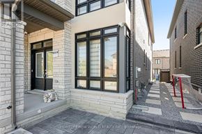 Aurora apartment for rent - A modern house with a stone facade and a glass door.