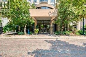 Toronto (Willowdale East) condo for rent - The image shows a building entrance with a glass door and a number 10 on it.