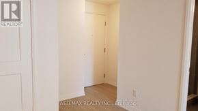 Toronto (Waterfront Communities) condo for rent - A white door is in a white room.