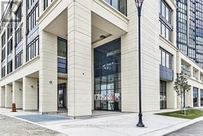Vaughan (Concord) condo for rent - A modern building with a white facade and large windows.