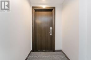 Vaughan (Concord) condo for rent - A brown door with a keypad on it.