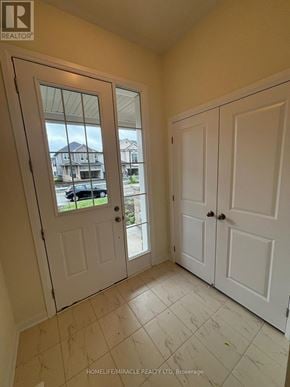 Loyalist (Bath) apartment for rent - A white door with a glass window is in a room with white walls.