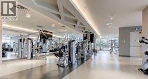Mississauga condo for rent - A gym with a variety of equipment including treadmills, weights, and exercise machines.