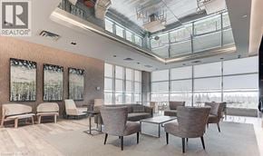 Mississauga condo for rent - A living room with a glass ceiling and a view of trees outside the windows.