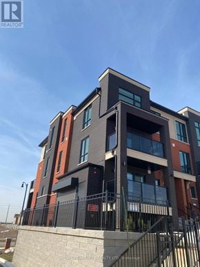 Brampton (Northwest Brampton) townhouse for rent - A modern multi-story building with a mix of brick and panel construction.