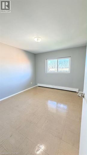 Guelph apartment for rent - A room with a window and a tiled floor.