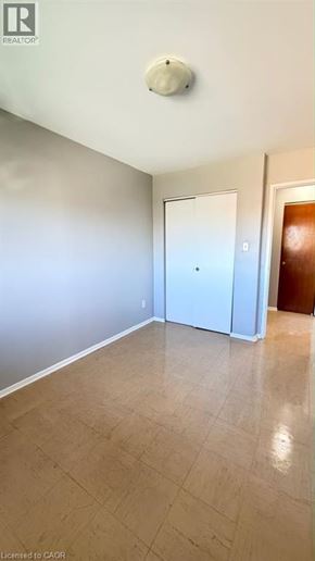 Guelph apartment for rent - A room with a white door and a brown door.