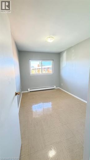 Guelph apartment for rent - A room with a window and a tiled floor.