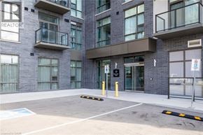 Waterdown condo for rent - A building with the word REALTOR on the side of it.