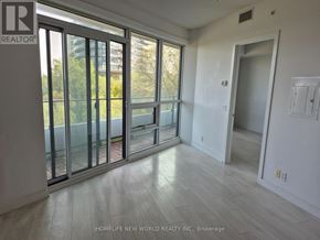 Toronto (Mimico) condo for rent - A room with a sliding glass door leading to a balcony.