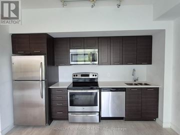 Toronto (Mimico) condo for rent - A kitchen with dark brown cabinets and stainless steel appliances.