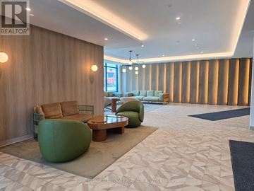 Toronto (Banbury-Don Mills) condo for rent - A modern living room with a green bean bag chair and a wooden wall.