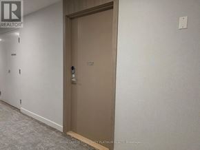 Toronto (Banbury-Don Mills) condo for rent - A brown door with the number 1107 on it.