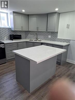 Burlington apartment for rent - A kitchen with a white island in the middle.