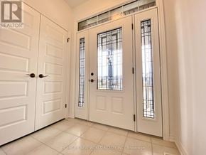 Collingwood apartment for rent - A white door with a glass panel and a handle.