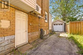 Hamilton (Crown Point) apartment for rent - A brick house with a white door and a small garage.