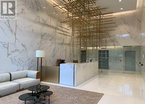 Toronto (Church-Yonge Corridor) condo for rent - A reception area with a white marble floor and a white reception desk.