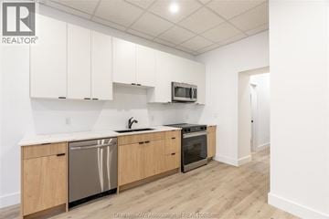 Chatham apartment for rent - A kitchen with wooden cabinets and stainless steel appliances.