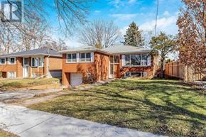 Toronto (Kingsview Village-The Westway) apartment for rent - A row of houses with a grassy front yard.