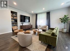 Lakeshore apartment for rent - A living room with a green sofa and a wooden floor.