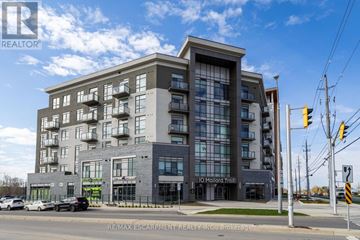 Hamilton (Waterdown) condo for rent - A modern apartment building with a glass facade and a sign that reads "Q Malard Troll.".