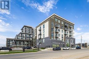 Hamilton (Waterdown) condo for rent - A building with the RE/MAX Escarpment Realty logo on it.